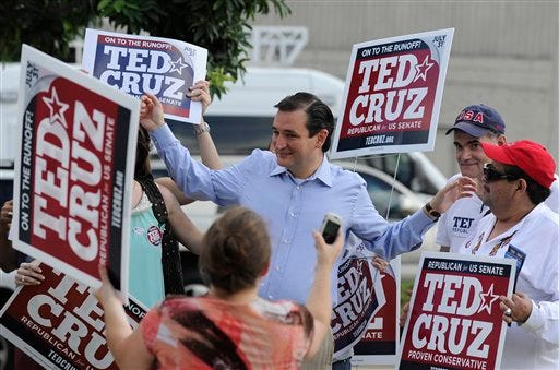 Former Texas Solicitor General Ted Cruz, center, greets supporters at a voting precinct Tuesday, July 31, 2012, in Houston. Cruz faces Lt. Gov. David Dewhurst in the Republican primary runoff election for the Republican nomination for the U.S. Senate.