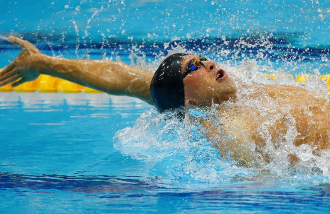 United States' Matthew Grevers swims during his men's 100-meter backstroke final at the Aquatics Centre in the Olympic Park during the 2012 Summer Olympics in London, Monday, July 30, 2012.