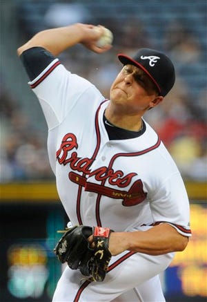 Atlanta Braves Kris Medlen pitches against the Miami Marlins during the second inning of a baseball game, Tuesday, July, 31, 2012, in Atlanta. (AP Photo/John Amis)