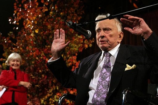 In this Nov. 19, 2009 file photo, actress Joanne Woodward, left, stands by as Gore Vidal speaks at the National Book Awards in New York. Woodward presented Vidal with the Medal for Distinguished Contribution to American Letters. Vidal died Tuesday, July 31, 2012, at his home in Los Angeles. He was 86. (AP Photo/Tina Fineberg, File)