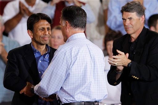 Republican presidential candidate and former Massachusetts Gov. Mitt Romney greets Louisiana Gov. Bobby Jindal as Texas Gov. Rick Perry is at right as he campaigns at Basalt Public High School, in Basalt, Colo., Thursday, Aug. 2, 2012, en route to Aspen, Colo. (AP Photo/Charles Dharapak)
