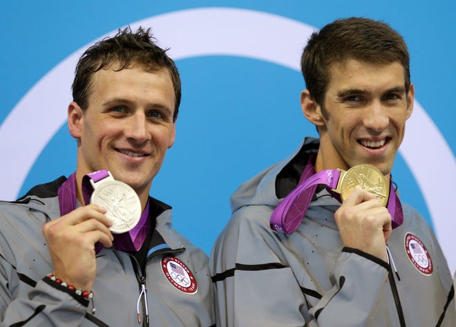 United States' Michael Phelps, right, and United States' Ryan Lochte pose with their medals for the men's 200-meter individual medley swimming final at the Aquatics Centre in the Olympic Park during the 2012 Summer Olympics in London, Thursday, Aug. 2, 2012. Phelps won gold and Lochte silver.