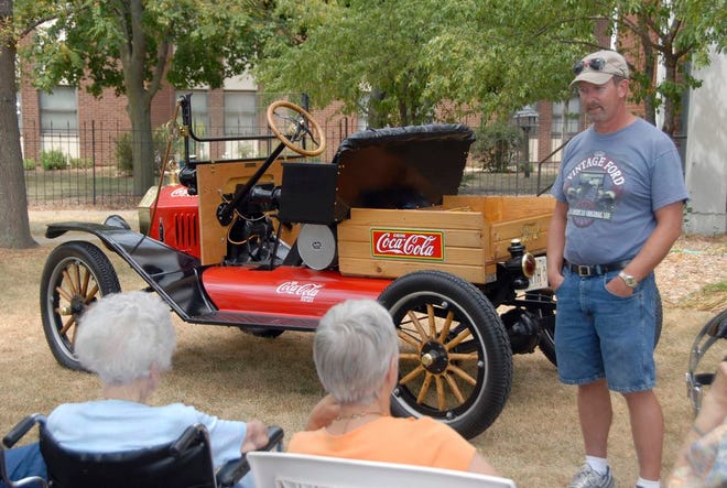 1915 Ford Model T owner Jim Haley discusses the history of Henry Ford and the Model T with Evenglow Lodge residents.