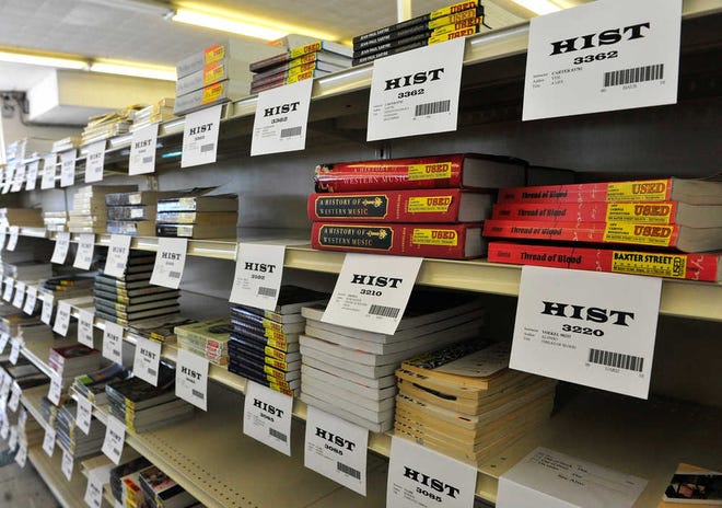 Textbooks fill the shelves at Off Campus Bookstore on Thursday, Aug. 2, 2012 in Athens, Ga.  Richard Hamm/Staff