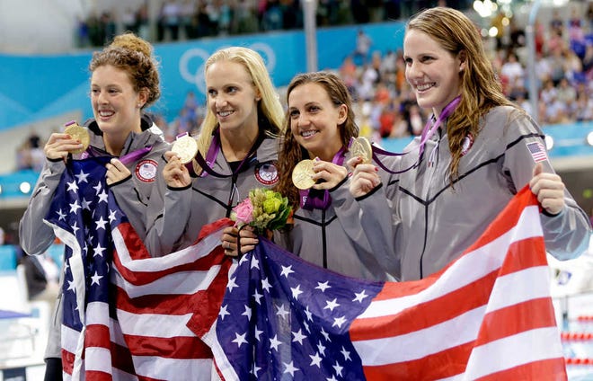 United States' 4 x 100-meter medley relay team from left, Allison Schmitt, Dana Vollmer, Rebecca Soni and Missy Franklin pose with their gold medals at the Aquatics Centre in the Olympic Park during the 2012 Summer Olympics in London, Saturday, Aug. 4, 2012. (AP Photo/Lee Jin-man)