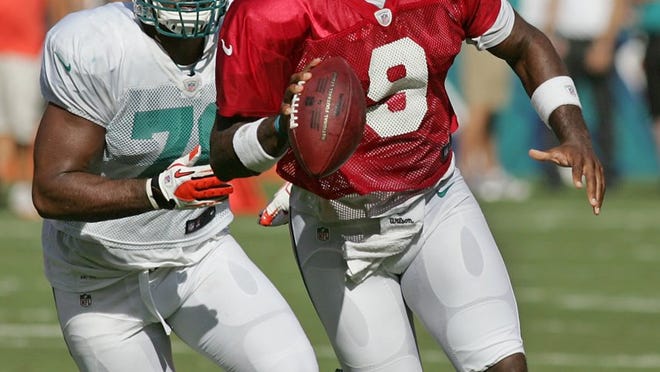 Miami Dolphins quarterback David Garrard (9) runs with the ball during the team's training camp scrimmage on Saturday, August 4, 2012, at Sun Life Stadium in Miami Gardens, Florida. (Andrew Uloza/Miami Herald/MCT