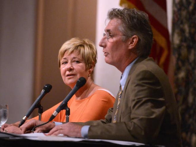 Supervisor of Elections Kathy Dent and her challenger, outgoing County Commissioner Jon Thaxton, debate at the Sarasota Tiger Bay Club at Michael's On East in July.