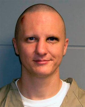 This photo released Tuesday, Feb. 22, 2011, by the U.S. Marshal's Service shows Jared Lee Loughner, the suspect in the Tucson shooting rampage that killed six people and left several others wounded, including then-U.S. Rep. Gabrielle Giffords. A person familiar with the Jared Lee Loughner case says a court-appointed psychiatrist will testify Tuesday, Aug. 7, 2012 that Loughner is competent to enter a plea in the murders and attempted murders including the wounding of former U.S. Rep. Gabrielle Giffords. (AP Photo/U.S. Marshal's Office, File)