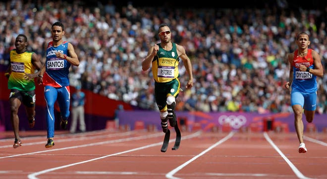 South Africa's Oscar Pistorius, center, leads Jamaica's Rusheen McDonald, left, Dominican Republic's Luguelin Santos, second left and Russia's Maksim Dyldin in a men's 400-meter heat Saturday in the Olympic Stadium in London.