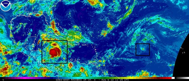 Tropical Storm Ernesto is seen outlined in a black box to the left of this early Monday satellite image from the National Oceanic and Atmospheric Administration. A weakening Tropical Depression Florence is seen in the smaller black box to the right of the image.