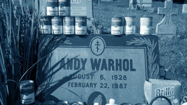 Fans have decorated Andy Warhol's tombstone with Campbell's soup cans and other pop art items on his birthday, which was Monday. Warhol would have been 84.