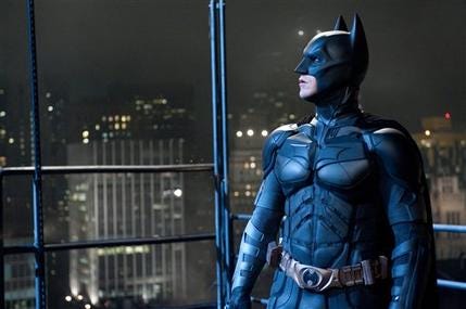 In this file film image provided by Warner Bros., Christian Bale portrays Bruce Wayne and Batman in a scene from "The Dark Knight Rises." The Dark Knight Rises" stayed atop the box office for the second straight weekend, making just over $64 million. But it's lagging behind the staggering numbers of its predecessor, 2008's "The Dark Knight."