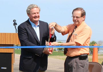 Gov. Jack Dalrymple and Devils Lake Mayor Dick Johnson cut the ribbon on the recently completed $15 million road raise project at Grahams Island State Park. The road was raised six feet to an elevation of 1,461 feet above mean sea level (msl).