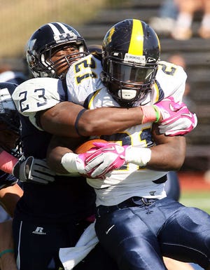 Jahmil Taylor, left, returns to lead the Washburn Ichabods' defense and build on 2011's success.