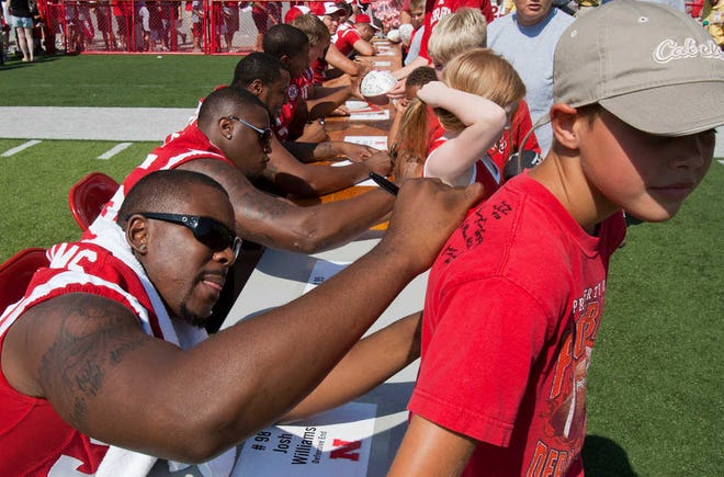 Defensive end Josh Williams, left, came to Kansas after violating team rules while playing at Nebraska.