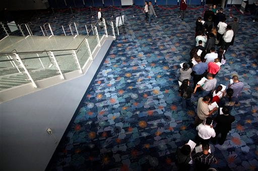 In this June 13, 2012 file photo, job seekers wait in line at a job fair expo in Anaheim, Calif. U.S. employers posted the most job openings in four years in June, a positive sign that hiring may pick up. The increase comes after employers added the most jobs in five months in July. (AP Photo/Jae C. Hong, File)