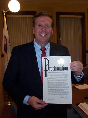 Mayor Kevin Meade holds up a proclamation he signed Tuesday at the Canton City Council meeting in which the city congratulated the Emiquon Complex for being designated a "Wetlands of International Importance" by the Ramsar Convention, an international treaty with 162 member nations committed to the conservation and wise use of wetlands and their resources. Lt. Gov. Sheila Simon and other dignitaries will be on hand at 2:30 p.m. today, Aug. 8, at Dickson Mounds Museum to dedicate the Emiquon Complex and (simultaneously via satellite) the Dixon Waterfowl Refuge near Hennepin for gaining international prestige for transforming flood-prone farmland into natural habitats for endangered and native species and plants. Prior to the dedication ceremony, Simon and others will attend a meeting of the Illinois River Coordinating Council at 1:30 p.m. at the Dickson Mounds Museum auditorium.