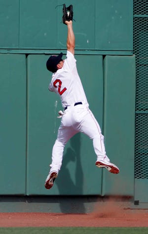 Boston center fielder Jacoby Ellsbury makes a leaping catch of a ball hit by Texas' Mitch Moreland on Wednesday in Boston. The Rangers won, 10-9.