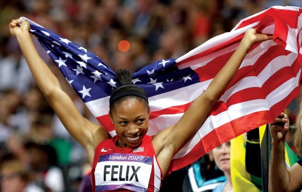 Allyson Felix of the U.S. celebrates her win in the women's 200-meter final Wednesday at the Olympic Stadium in London. (AP PHOTO/LEE JIN-MAN)