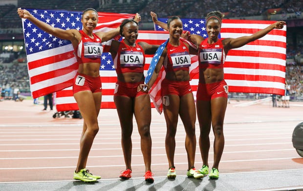 (L-R) Allyson Felix, Bianca Knight, Carmelita Jeter and Tianna Madison of the U.S. celebrate after they won gold in the women's 4x100m relay. They won in a world record time, completing the lap in a sizzling 40.82 seconds.
