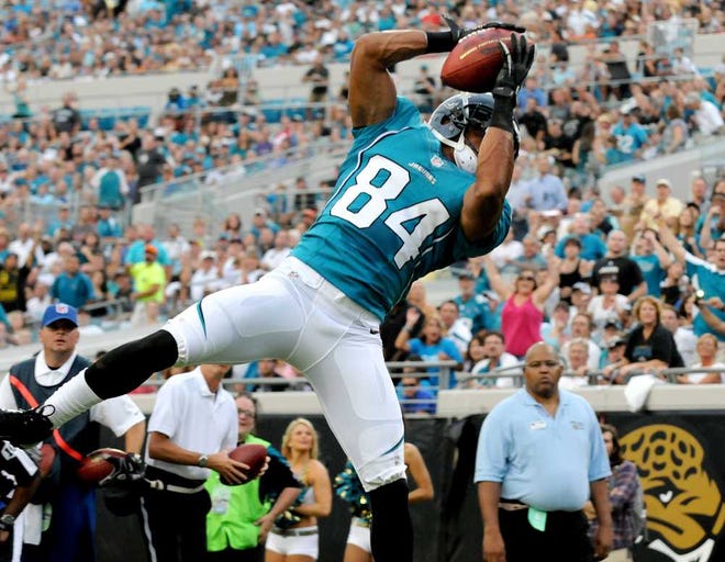 Bruce.Lipsky@jacksonville.com Jaguars wide receiver Cecil Shorts goes up to catch a 3-yard touchdown pass in the first quarter against the Giants at EverBank Field on Friday.