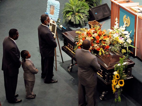 Mourners pause to show their respect at the funeral service for Connie L. Tindall, one of the members of the Wilmington Ten, at the Union Missionary Baptist Church Aug. 10.