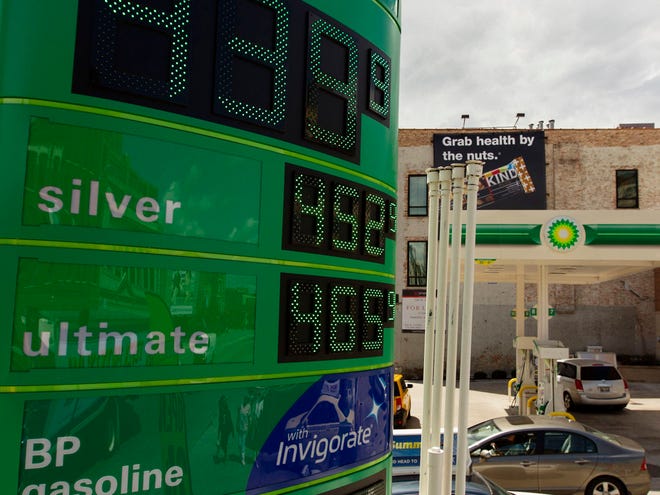 Gasoline prices are displayed at a gasoline station, Friday, in Chicago. A rise in the price of crude oil and problems with refineries and pipelines in the West Coast and Midwest have caused prices at the pump to surge upward. (The Associated Press)