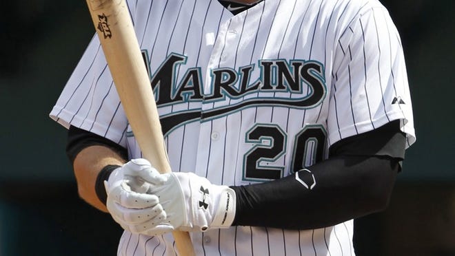 Florida Marlins' Logan Morrison prepares for his at-bat against the Cincinnati Reds during the first game of a doubleheader in Miami Gardens on Wednesday, Aug. 24, 2011. (AP Photo/Hans Deryk)