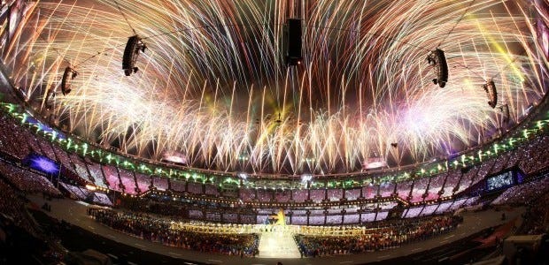 In this photo taken with a fisheye lens, pyrotechnics light up the sky above the Olympic Stadium during the closing ceremony at the 2012 Summer Olympics on Sunday in London.