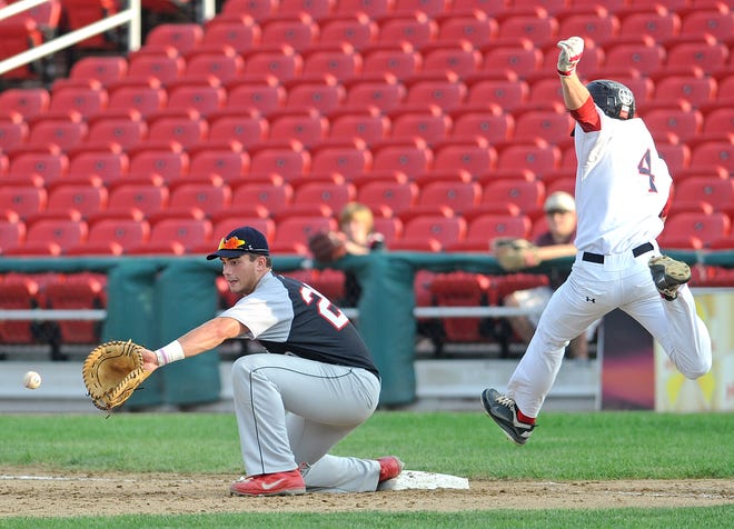 Brockton Rox Sean Ryan crosses first base while Nashua Silver Knights first baseman Chris Shaw waits for the ball in a controversial play during a playoff game at Campanelli Stadium in Brockton on Sunday, August 12, 2012. The runner was ruled out.