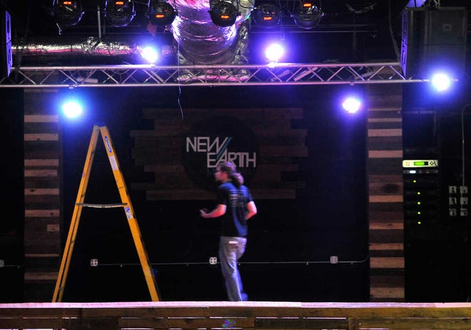 A worker puts the final touches on the stage lights at New Earth Music Hall on Wednesday, Aug. 8, 2012 in Athens, Ga. Richard Hamm/Staff
