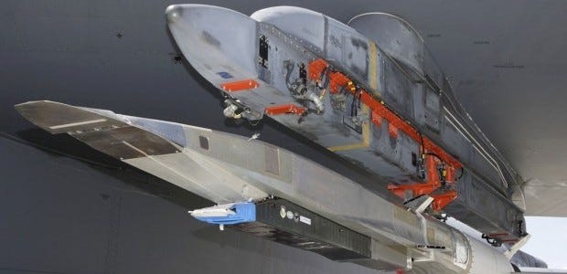 An X-51A WaveRider hypersonic flight test vehicle is uploaded to an Air Force Flight Test Center B-52 for fit testing at Edwards Air Force Base. The unmanned aircraft designed to fly six times the speed of sound crashed after being dropped from a bomber over the Pacific Ocean, the Air Force said.