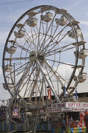 The large ferris wheel is at the annual Fairbury Fair, which gets under way today. A special section appears today outlining the events during the five-day fair.