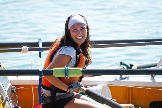 Jenn Gibbons smiles as she completes a 1,500 mile rowing trip around Lake Michigan to raise money for an organization helping cancer survivors on Tuesday, in Chicago. The trip helped 27-year-old Gibbons raise $113,000 for Recovery on Water (ROW).