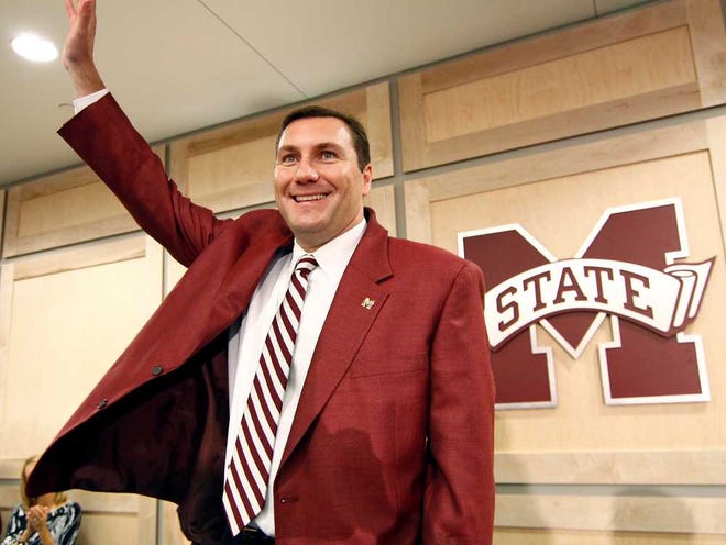 New Mississippi State University football coach Dan Mullen waves to fans after a pep rally at the Larry Templeton Athletic Academic Center in Starkville, Miss., Thursday, Dec. 11, 2008, after being introduced as the next head coach. Mullen has spent the last four years as offensive coordinator and quarterbacks coach at Florida. (AP Photo/Rogelio V. Solis)