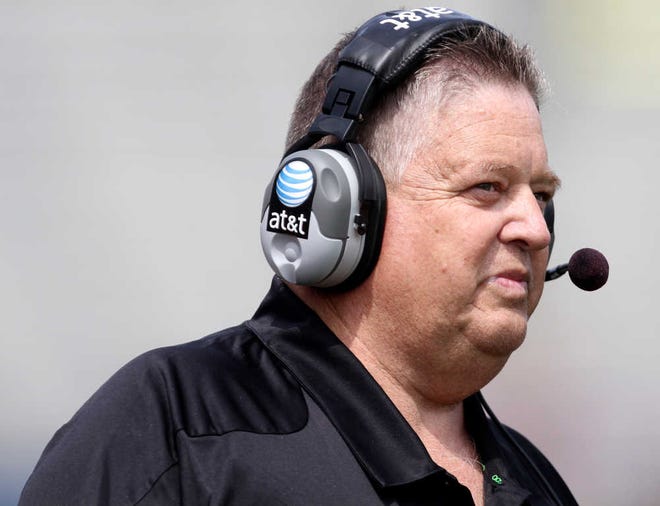 Kansas head coach Charlie Weis calls plays during his first spring football game at Memorial Stadium in Lawrence, Kan.