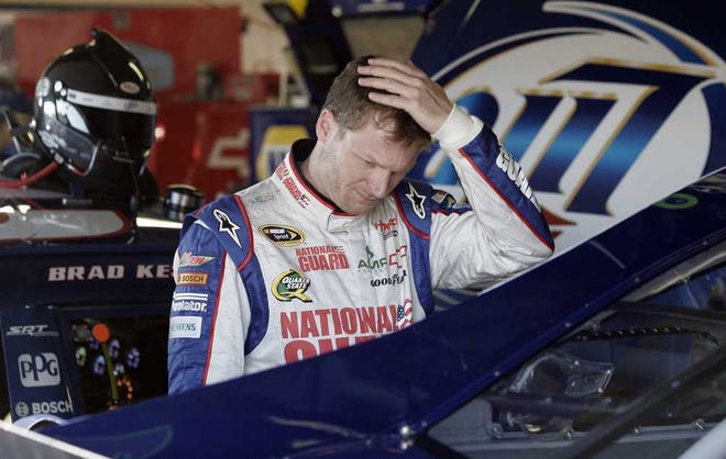 Luke Brodbeck Associated Press Dale Earnhardt Jr. looks at his car during practice at Michigan International Speedway on Saturday.