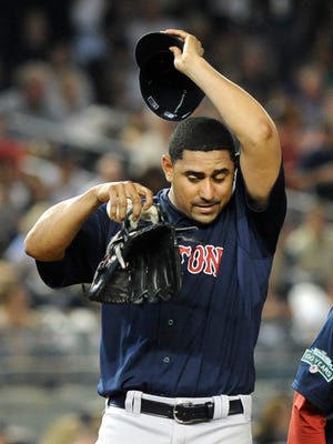 Red Sox Franklin Morales reacts after giving up a solo home run to Yankees' Derek Jeter in the fifth inning of Friday's game at Yankee Stadium in New York.