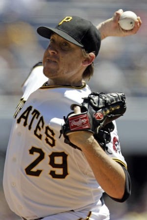 Pittsburgh Pirates pitcher Kevin Correia delivers in the second inning of a baseball game against the Chicago Cubs in Pittsburgh, Wednesday, July 25, 2012. (AP Photo/Gene J. Puskar)