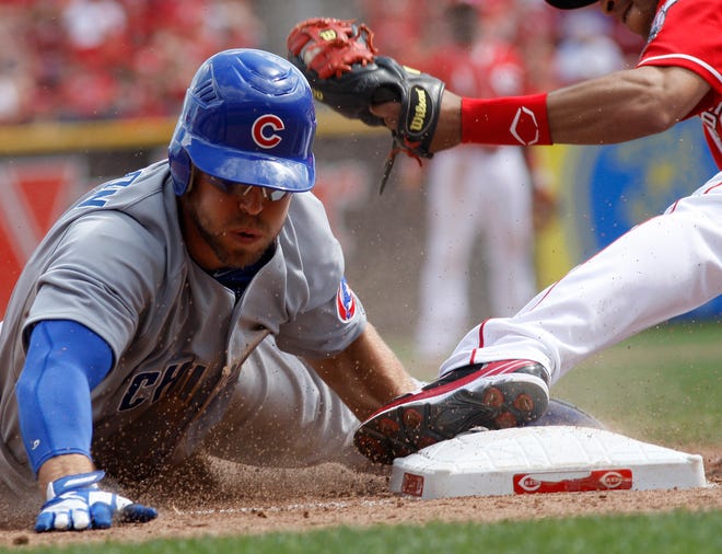 Chicago Cubs center fielder Brett Jackson is tagged out by Cincinnati Reds third baseman Wilson Valdez after attempting to steal third in the ninth inning of Sunday's game. The Reds won 5-4. (AP Photo/David Kohl)