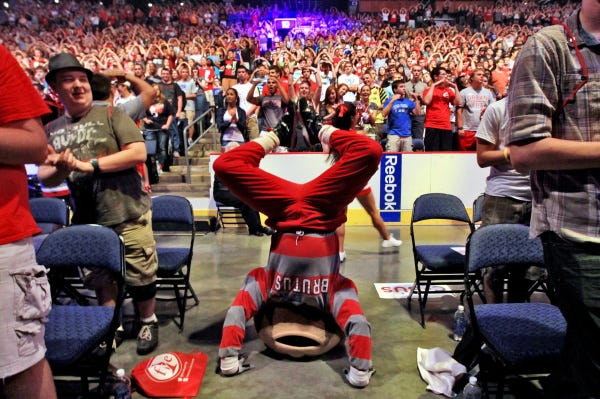 Brutus Buckeye does the traditional O-H-I-O chant with his legs during the Nationwide Arena portion of yesterday's three-venue welcoming gala for incoming Ohio State freshmen. The event began at St. John Arena before moving to Ohio Stadium.