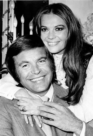 In this April 23, 1972 file photo, actor Robert Wagner and his former wife, actress Natalie Wood, pose at the Dorchester Hotel in London, England. Authorities amended Wood's death certificate on Aug. 1, 2012 to reflect some of the lingering questions about how the actress died in the waters off Catalina Island in November 1981. The changes include altering her cause of death to Drowning and other undetermined factors, and adding the statement, Circumstances not clearly established, as to how Wood ended up in the water while on a yacht with husband Robert Wagner and actor and co-star Christopher Walken.