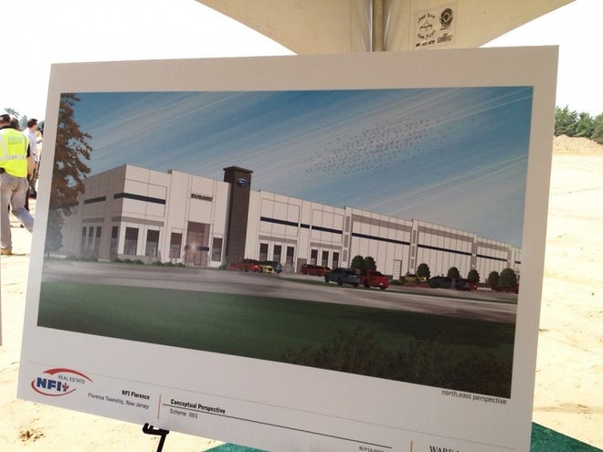 A conceptual drawing of the proposed Subaru parts plant is on display at the groundbreaking at the site on Route 130 in Florence on Wednesday.