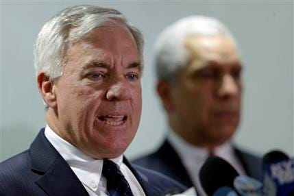 Defense lawyers for former Penn State President Graham Spanier, John E. Riley, left, and Timothy Lewis for speak during a news conference Wednesday, Aug. 22, 2012, in Philadelphia. Attorneys for Spanier dispute allegations in the university-funded investigation by former FBI director Louis Freeh, that Spanier covered up reports of child sex abuse involving convicted former assistant football coach Jerry Sandusky.
