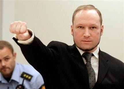 Mass murderer Anders Behring Breivik, makes a salute after he arrives at the court room in a courthouse in Oslo Friday Aug. 24, 2012 . Breivik has been declared sane and sentenced to prison for bomb and gun attacks that killed 77 people last year.