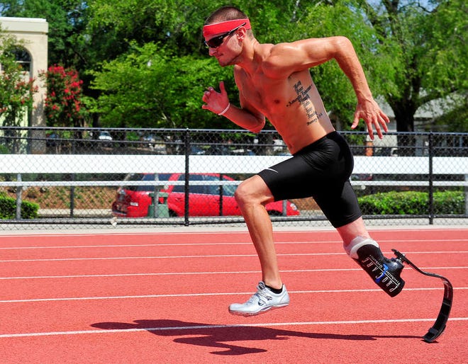 Jarryd Wallace trains for the Paralympics at the Spec Towns Track in Athens, Ga., Thursday, August 16, 2012. (AJ Reynolds/Staff)