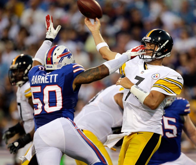 Pittsburgh Steelers' Ben Roethlisberger throws under pressure from Buffalo Bills' Nick Barnett (50) during the first half of a preseason NFL football game in Orchard Park, N.Y., Saturday, Aug. 25, 2012. (AP Photo/Gary Wiepert)