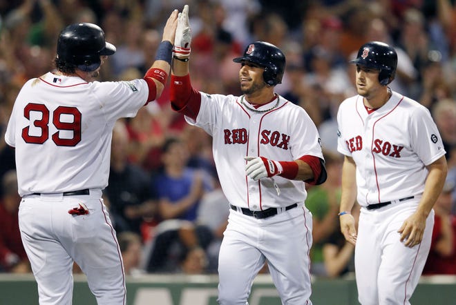 Boston Red Sox's Mike Aviles, center, celebrates his three-run home run that drove in Jarrod Saltalamacchia (39) and Ryan Lavarnway, right, in the second inning of a baseball game against the Kansas City Royals in Boston, Saturday, Aug. 25, 2012. ()