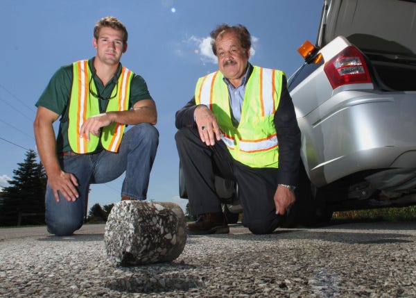 Ohio University researchers John Ubbing, left, and Shad Sargand are testing what's called "perpetual pavement" along Rt. 23 in Delaware County.