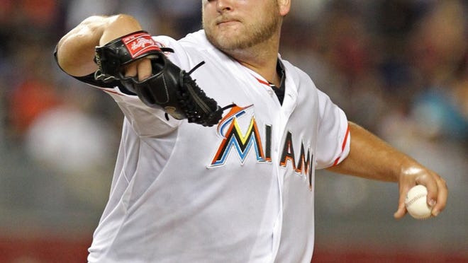 Miami Marlins starting pitcher Mark Buehrle works against the Washington Nationals at Marlins Park in Miami, Florida, on Saturday, July 14, 2012. The Marlins won, 2-1. (Al Diaz/Miami Herald/MCT)